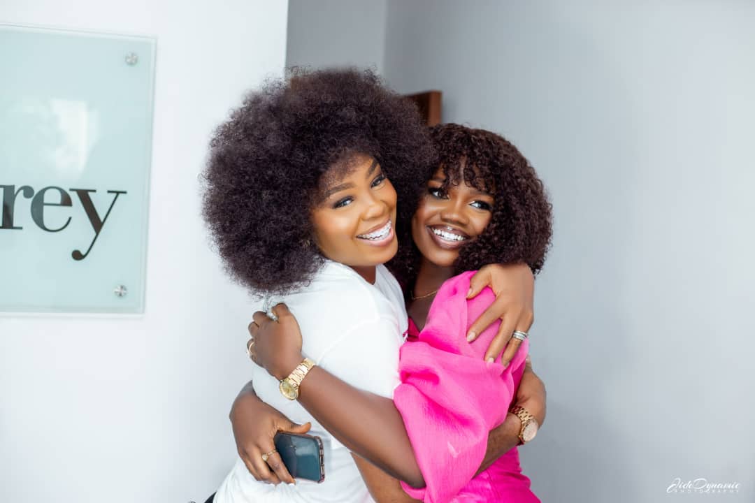 Two women entrepreneurs embracing and celebrating their authentic business connection and success